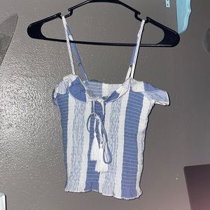 Adorable crop top with ruffles and tassels